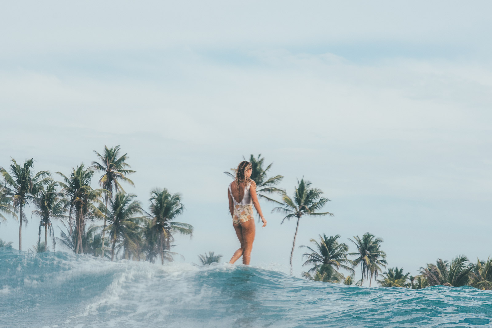 Karson surfing the island