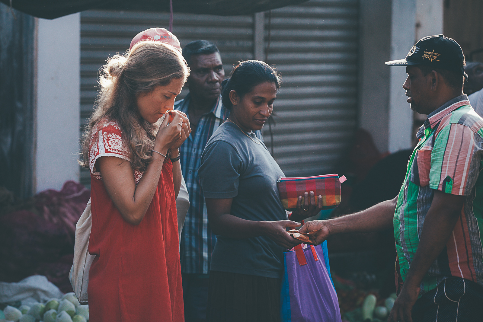 Diana choosing produce at the market