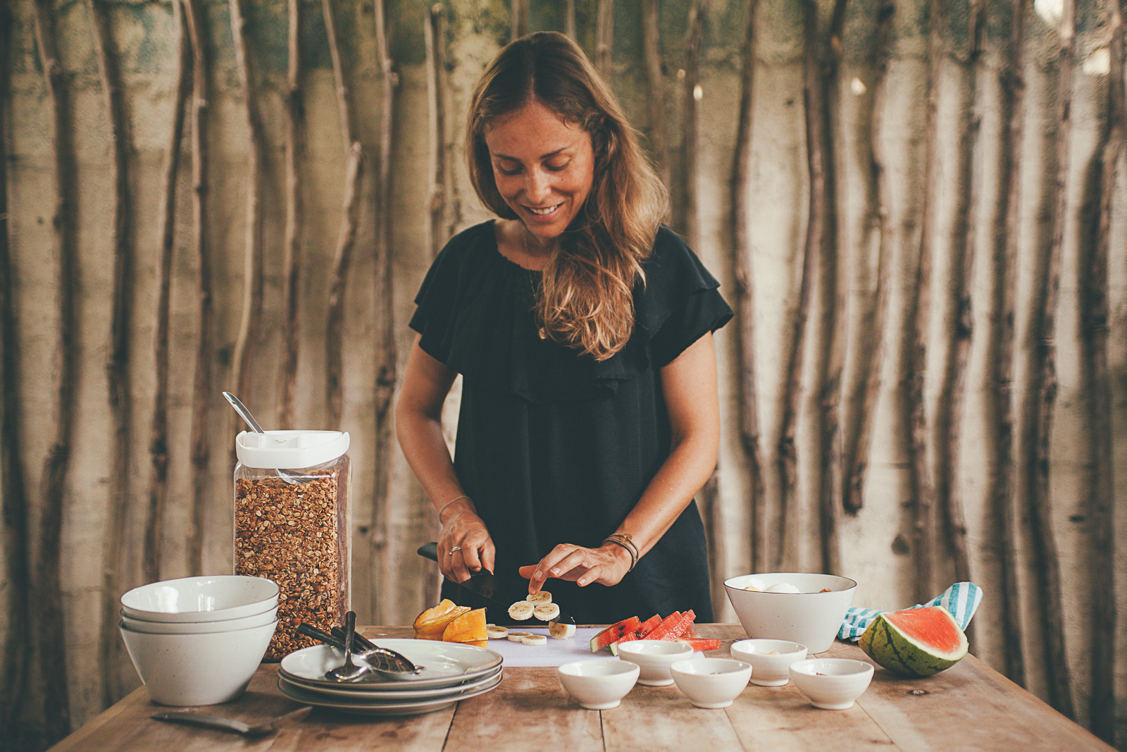 Diana making granola bowl